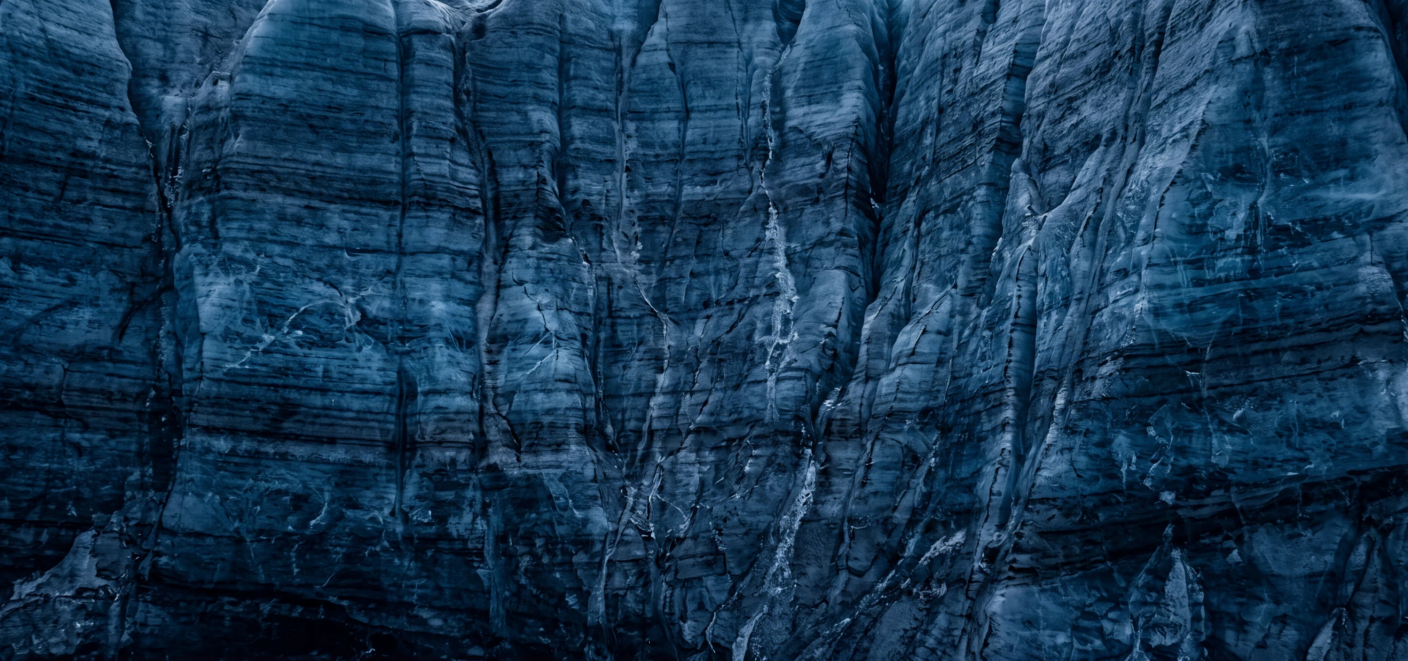 Longevity hero — crevasse ice, cold light